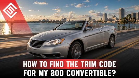 Silver Chrysler 200 Convertible driving by waterfront in guide to finding trim and interior codes for restoration.