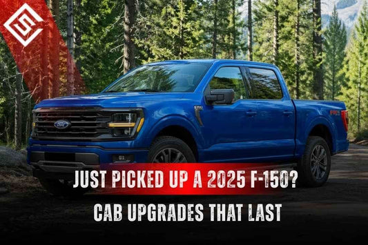 Blue 2025 Ford F-150 parked in a forest promoting durable cab upgrades, like seat covers and floor liners, for new trucks.