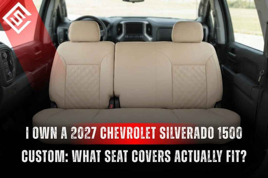 2027 Chevrolet Silverado 1500 Custom front seats with fitted beige seat covers shown across the front row of the truck cabin.